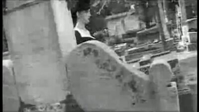 Dita von Teese at the tomb of Victor Noir